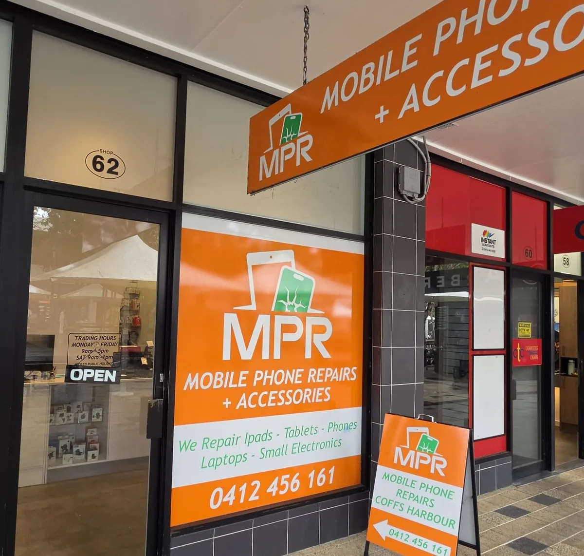 Orange Mobile Phone Repairs and Accessories sign in the window of Shop 62, City Centre Square (The Mall), Coffs Harbour